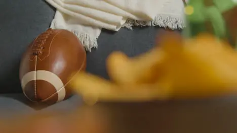 Lounge At Home Of Person Watching American Football Game On TV With Drinks Snacks And Ball 2