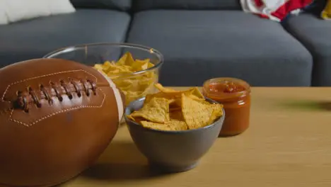 Lounge At Home After Watching American Football Game On TV With Drinks Snacks And Ball 2