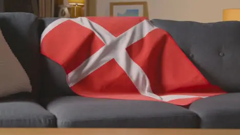 Flag Of Denmark Draped Over Sofa At Home With Football Ready For Match On TV 3