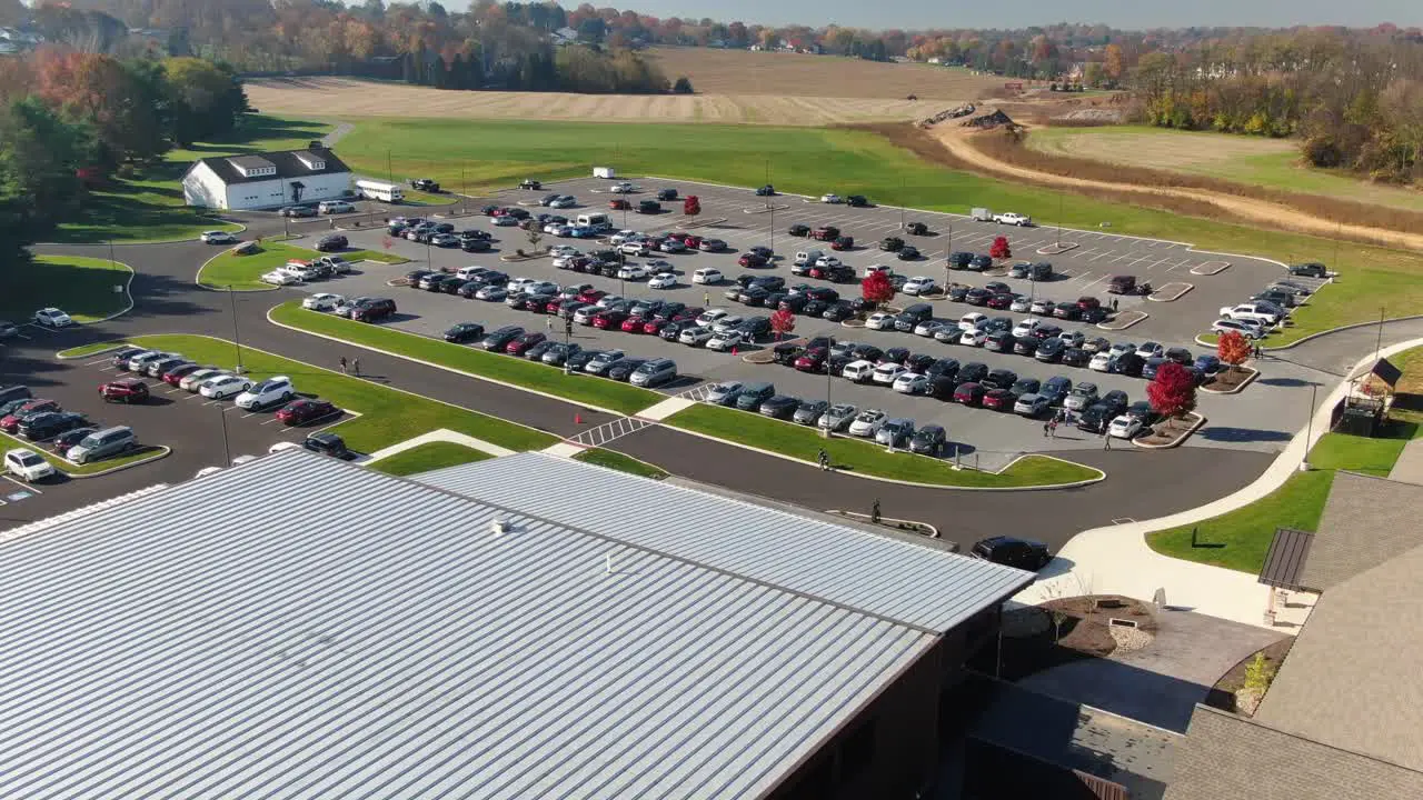 Aerial pullback reveals church building rooftop