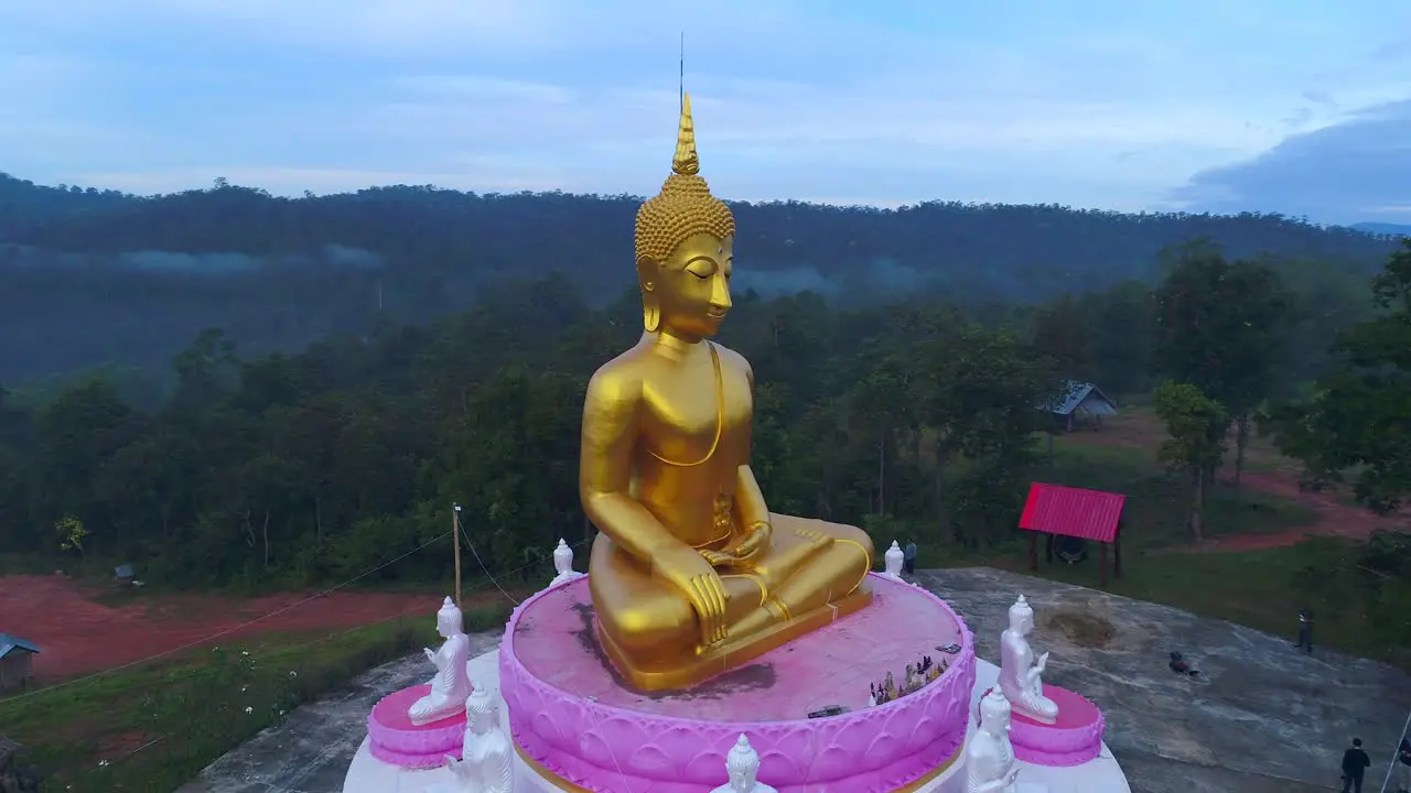 Huge Buddha Aerial Drone Orbit Statue Towering Mountians Laos Thailand