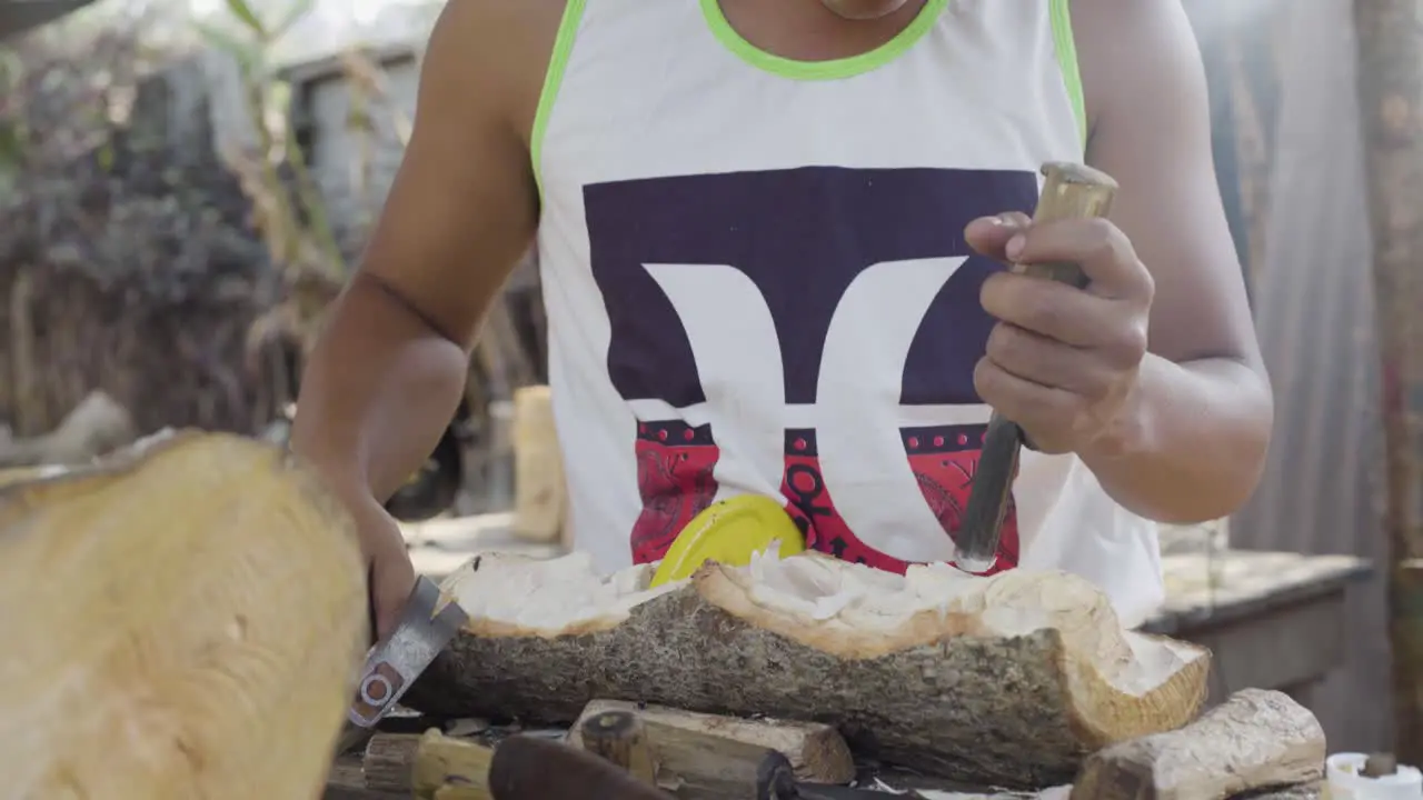 Woodcarvers in Antigua Guatemala carve souvenir wooden effigies of Jesus Christ during easter week Semana Santa 1