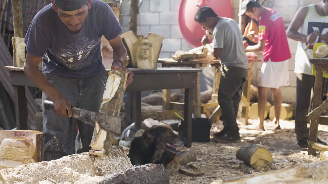 Woodcarvers in Antigua Guatemala carve souvenir wooden effigies of Jesus Christ during easter week Semana Santa 5