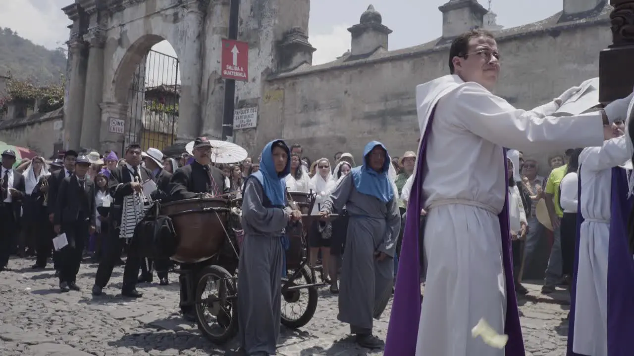 Purple robed Catholic Christian priests march in the Semana Santa Easter week holidays in Antigua Guatemala 3