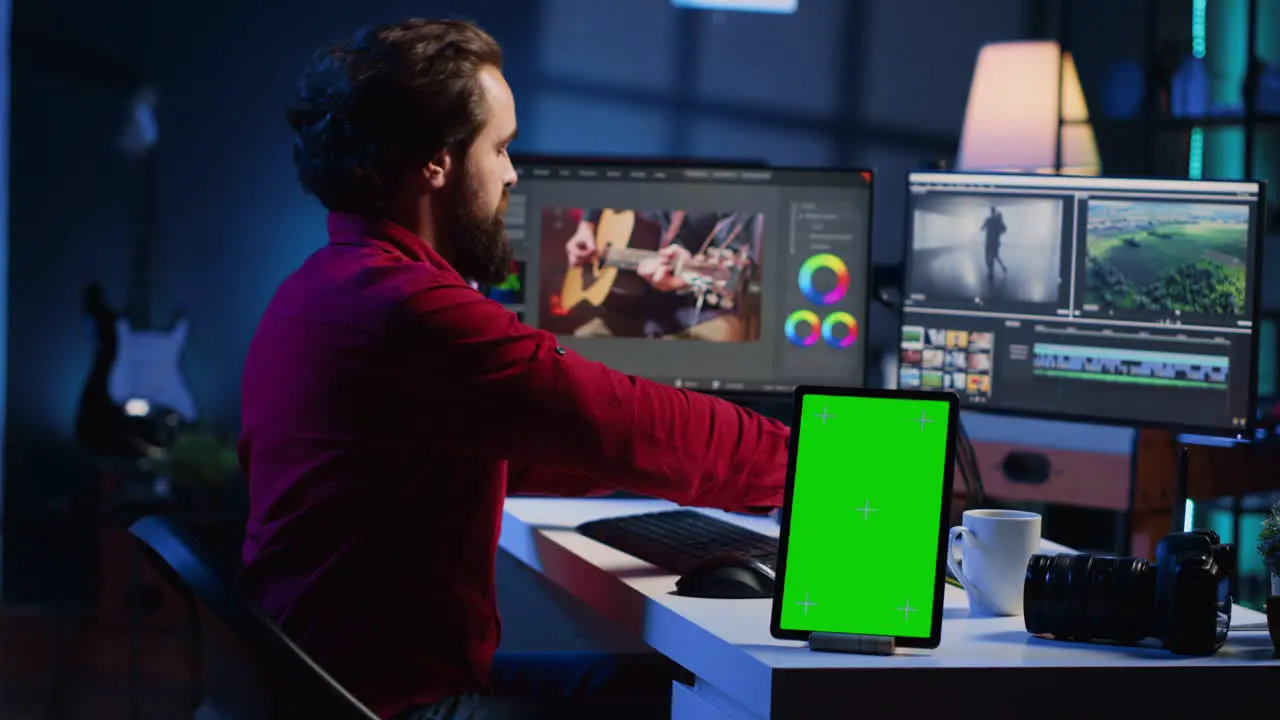 Videographer using headphones to test and improve audio quality next to mockup device