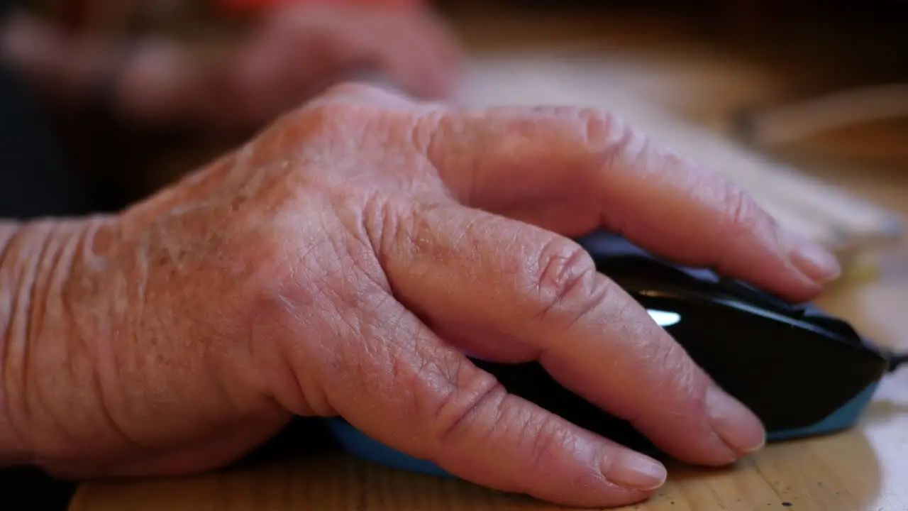 Old Hand Uses Computer Mouse