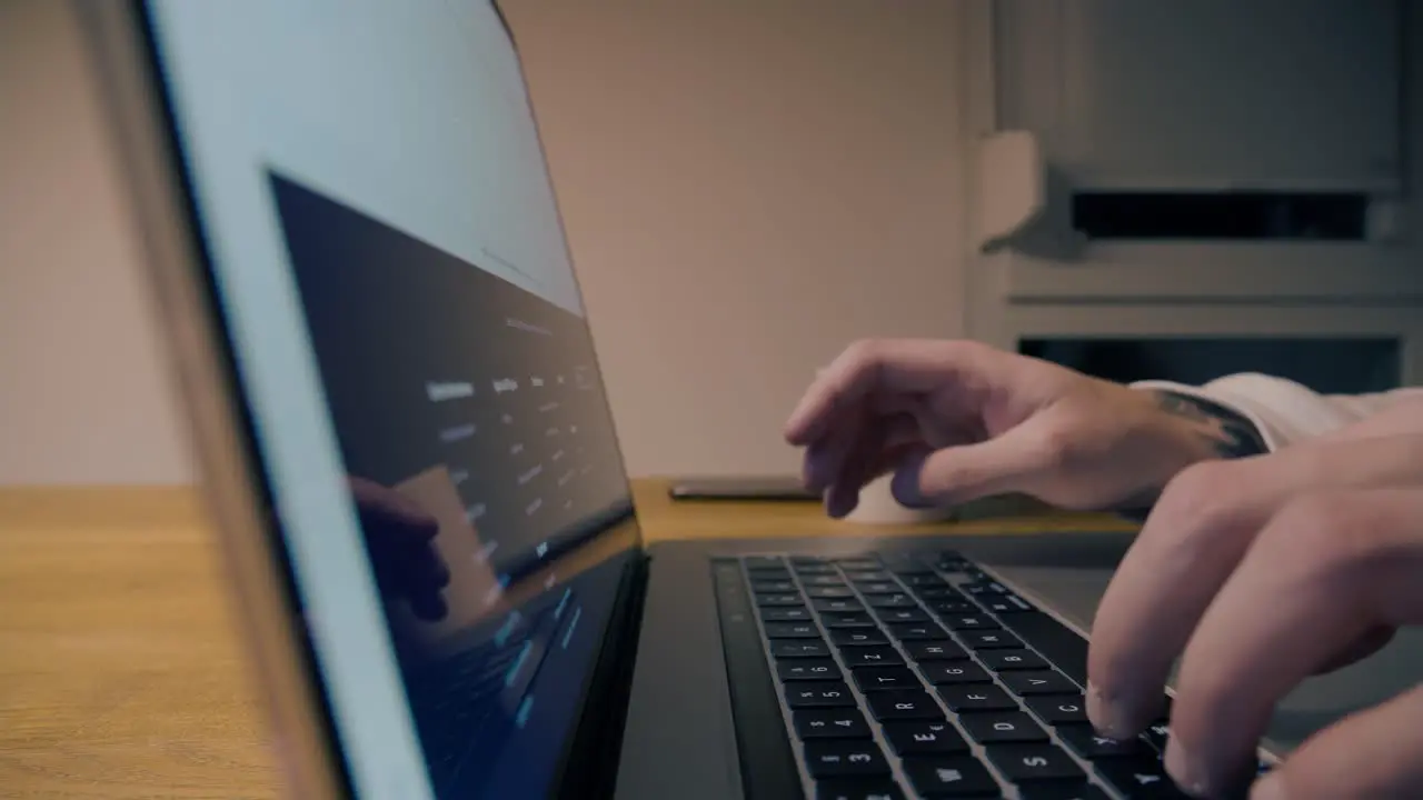 Panning reveal shot of a person searching video