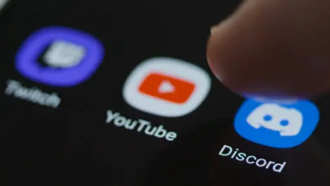 Close Up Shot of Finger Tapping the Discord On Smartphone 