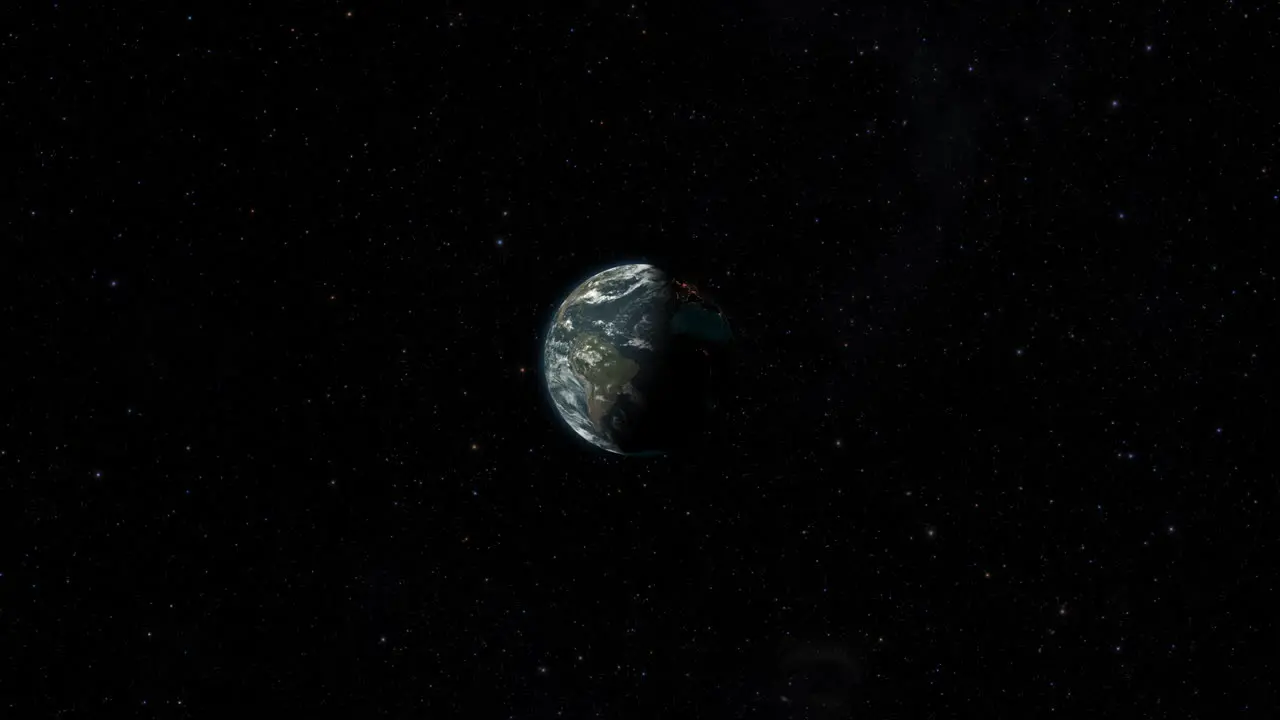 CGI composite planet earth rotating center-wide shot half lit with a starry background