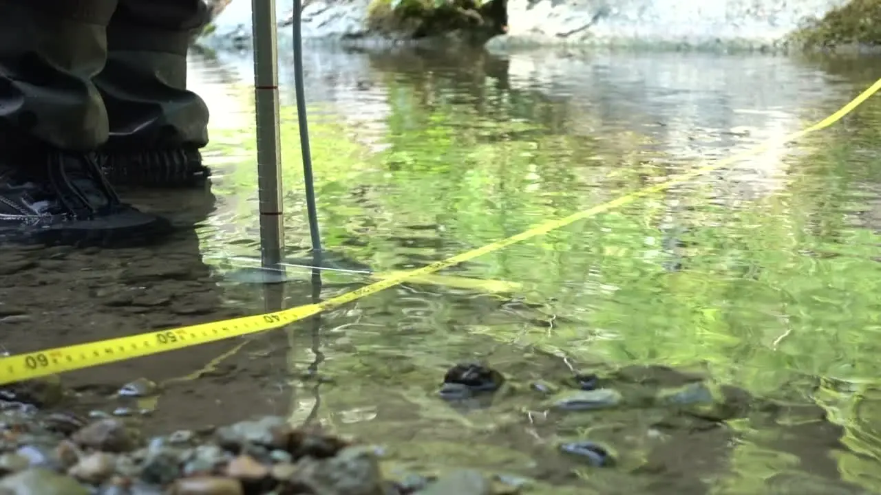 Yellow magnetic probe used to measure the flow of a Swiss river in the Alps environmental sciences