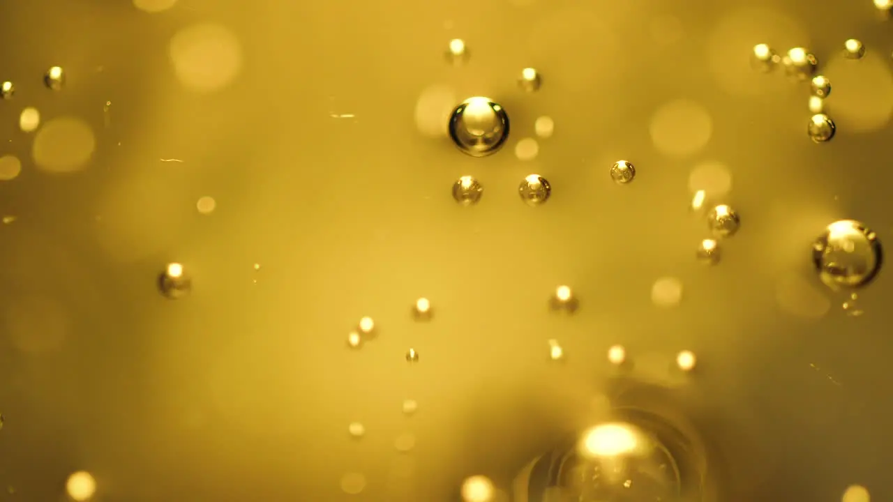 Abstract science or art background with gold bubbles rising