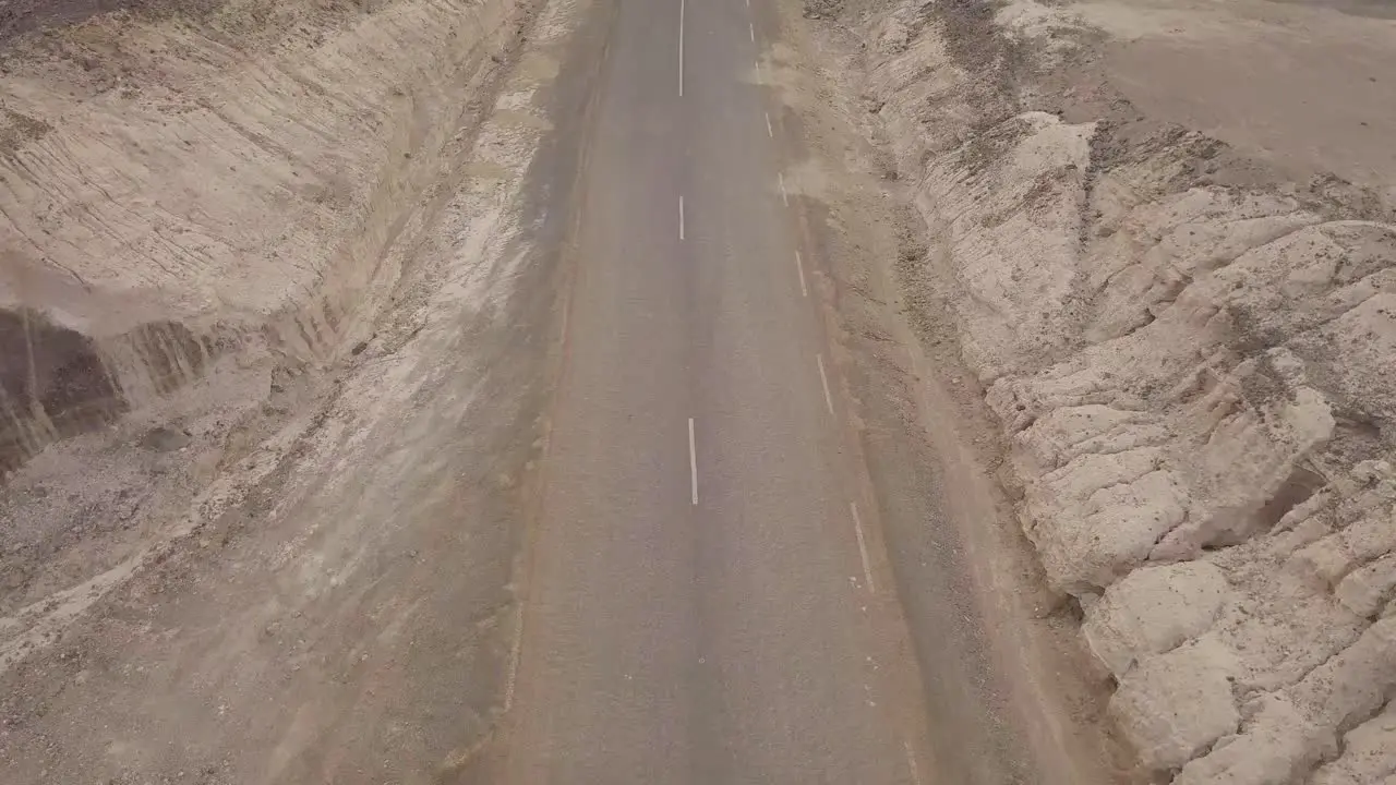 Good aerial above a pickup truck driving on a coastal road in Somalia or Djibouti