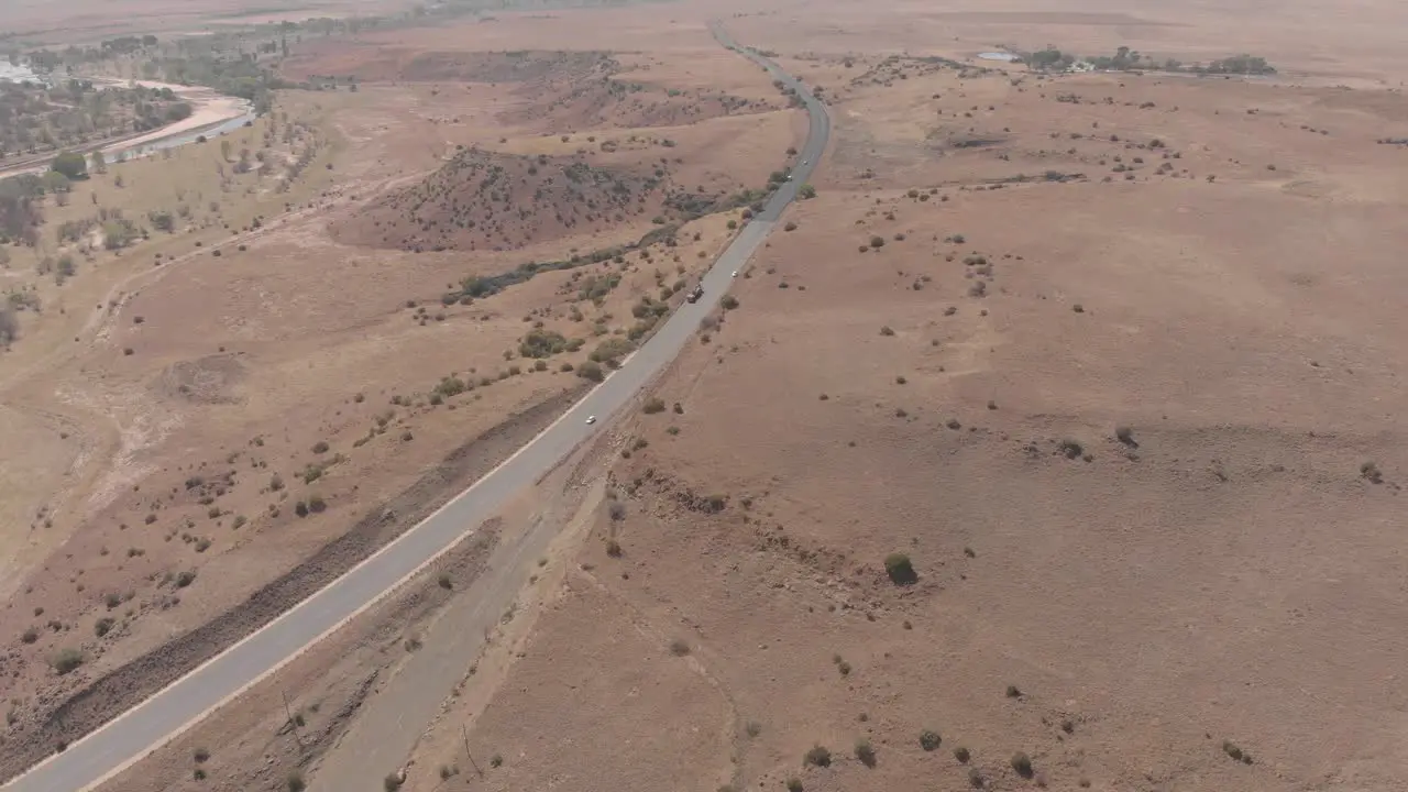 aerial shot tracking a truck on a national road