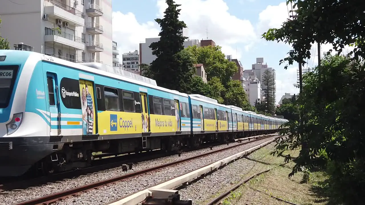 Sarmiento Public Line Train Railway Departs in Slow Motion at Urban Landscape