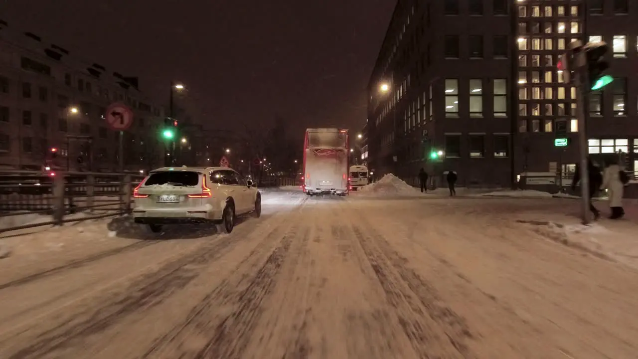 POV shot driving through downtown Helsinki at nighttime