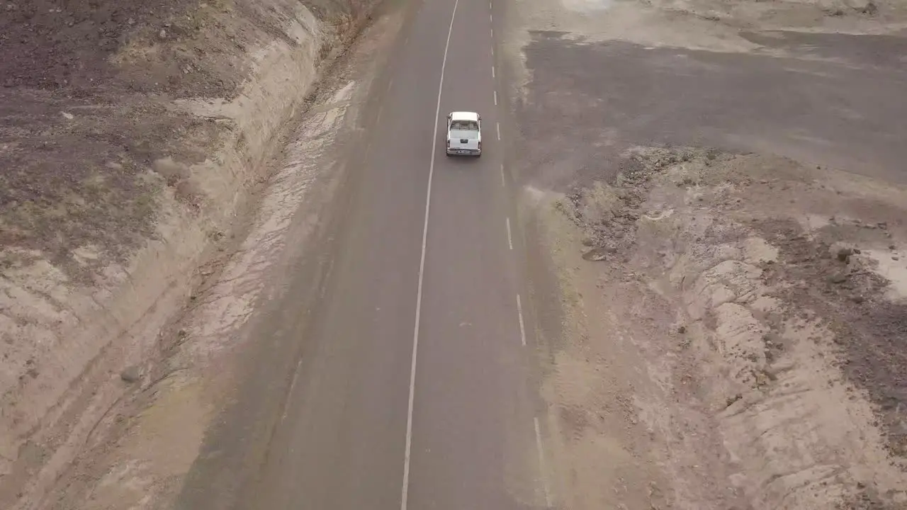 Good aerial above a pickup truck driving on a coastal road in Somalia or Djibouti 1