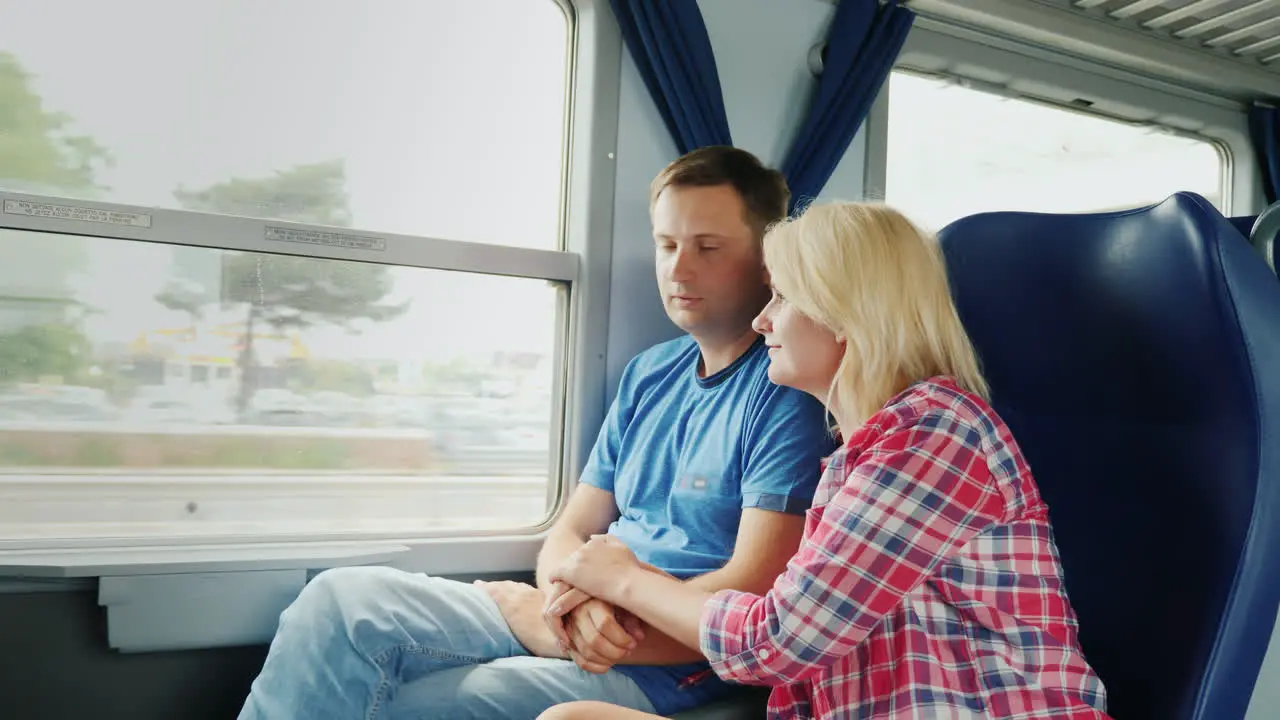 Couple Look Out Train Window