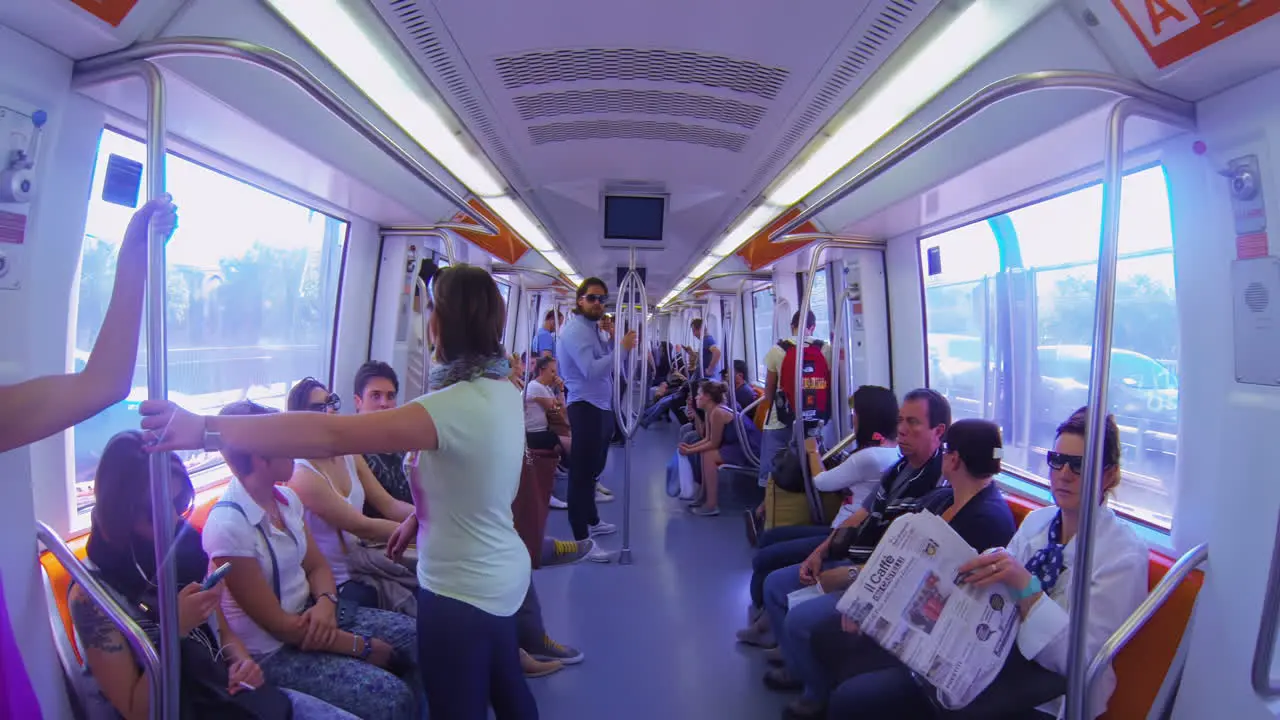 Interior of spacious futuristic metro with people and tourists in Rome