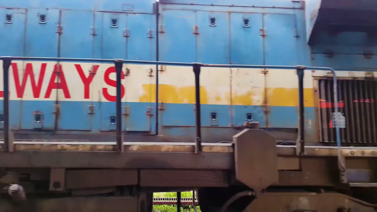 indian passenger express train leaving station on track at evening from flat angle video is taken at kamakhya railway station assam india on May 22 2022