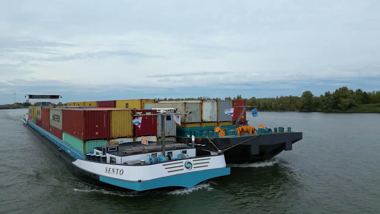 Aerial View Off Forward Bow Of Sento Cargo Ship Paired With Barge Travelling Along Oude Maas Through Puttershoek