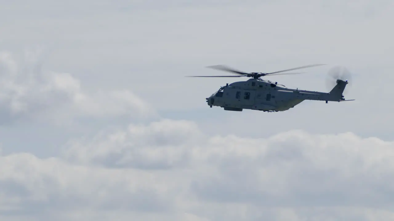 Military Transport Helicopter Flying on a Sunny Day Profile View TRACK