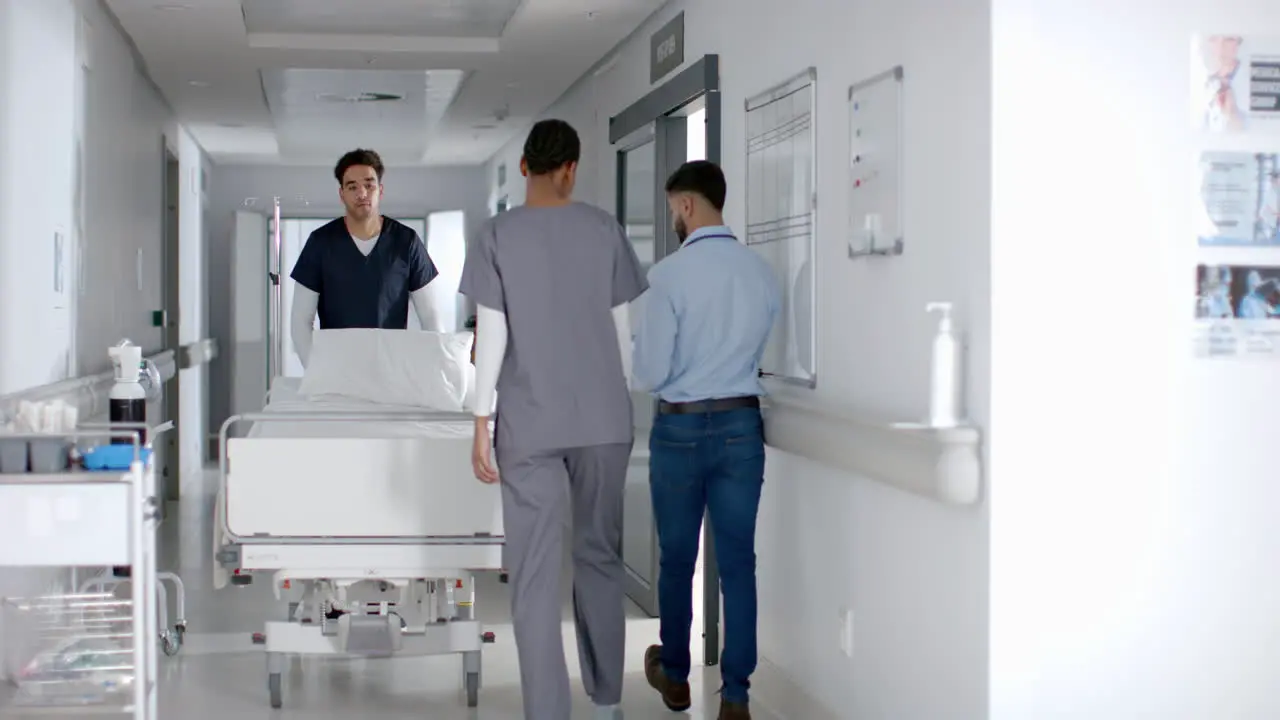 Healthcare professionals transport a patient in a hospital corridor