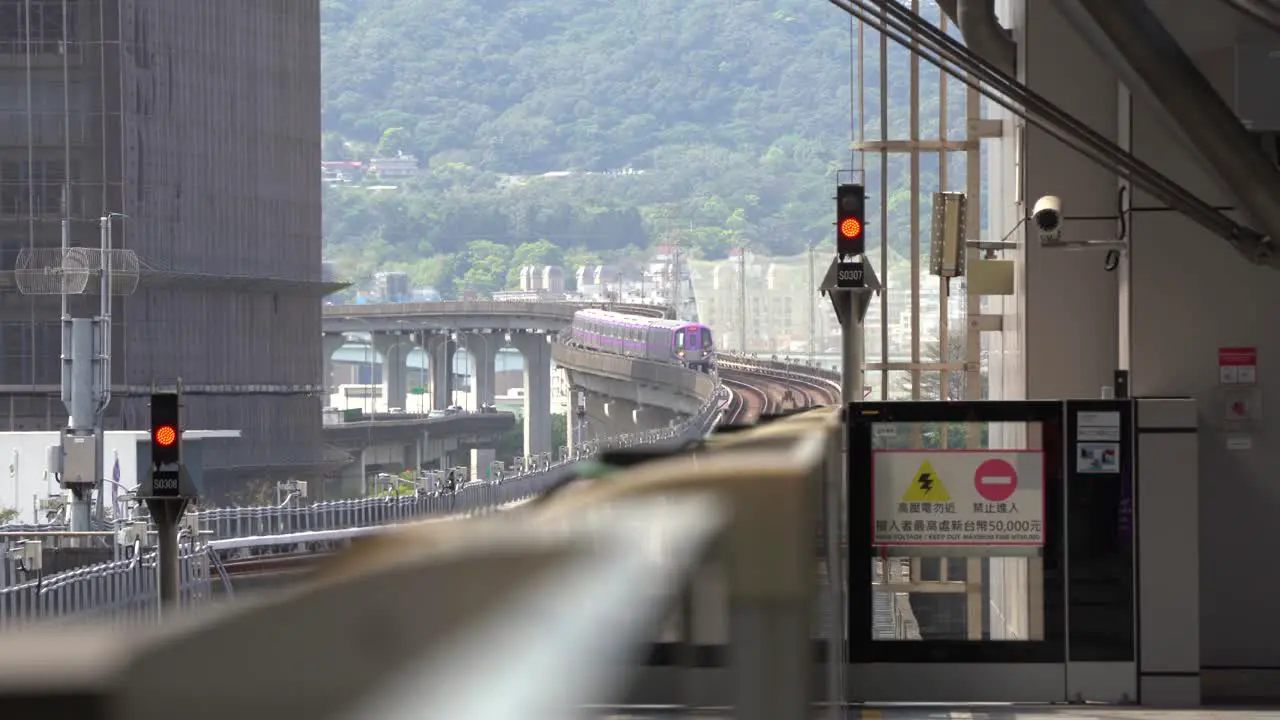 Passenger commuter train arriving to the station Taiwan efficient Railways Public Transportation system