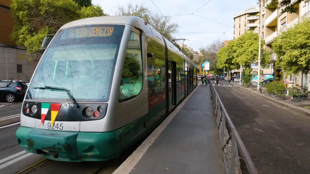 People Exiting Tram onto Platform at Routine Stop in Rome Italy