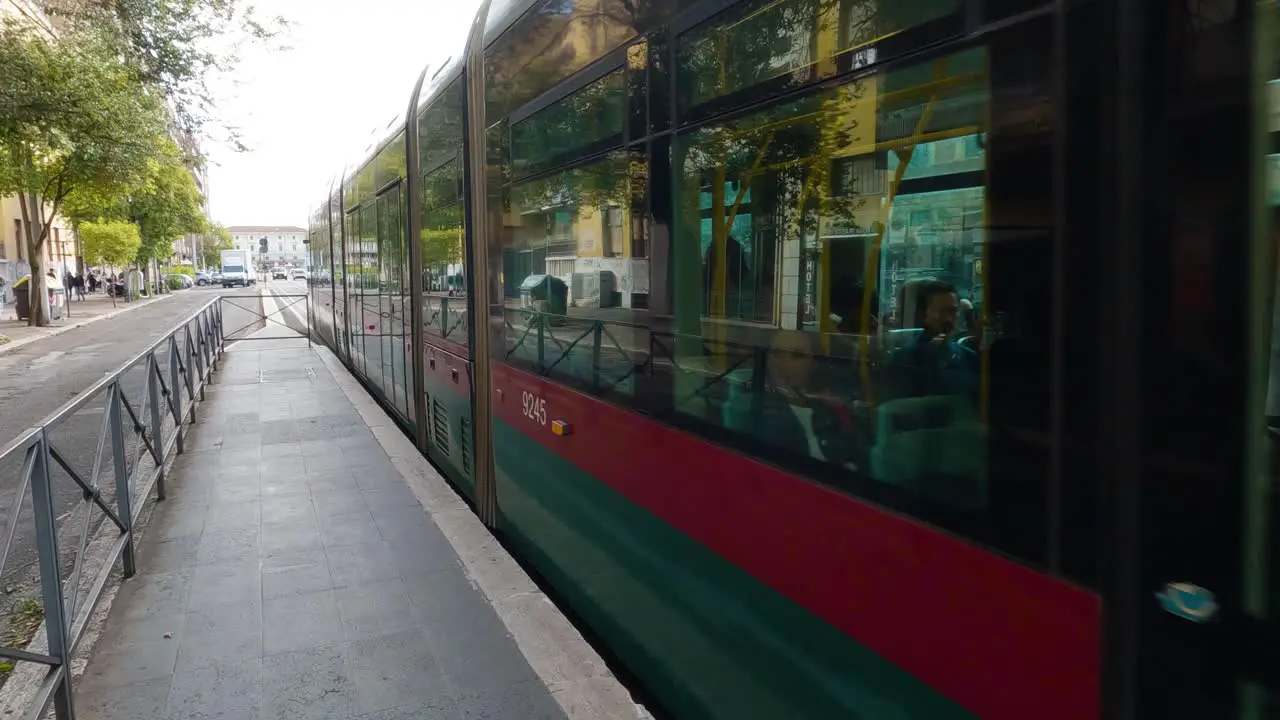 Tram Arriving at Stop on Typical Day in Rome Italy