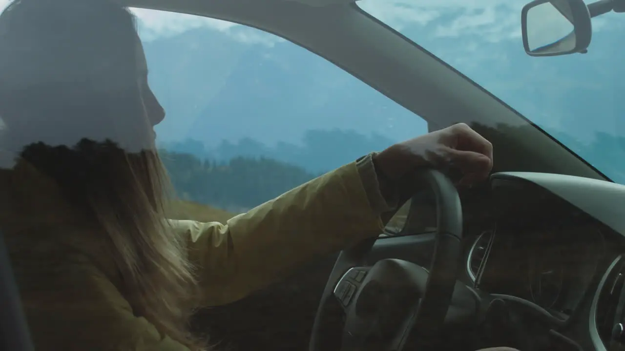 Woman Stopping Car in Mountains 01