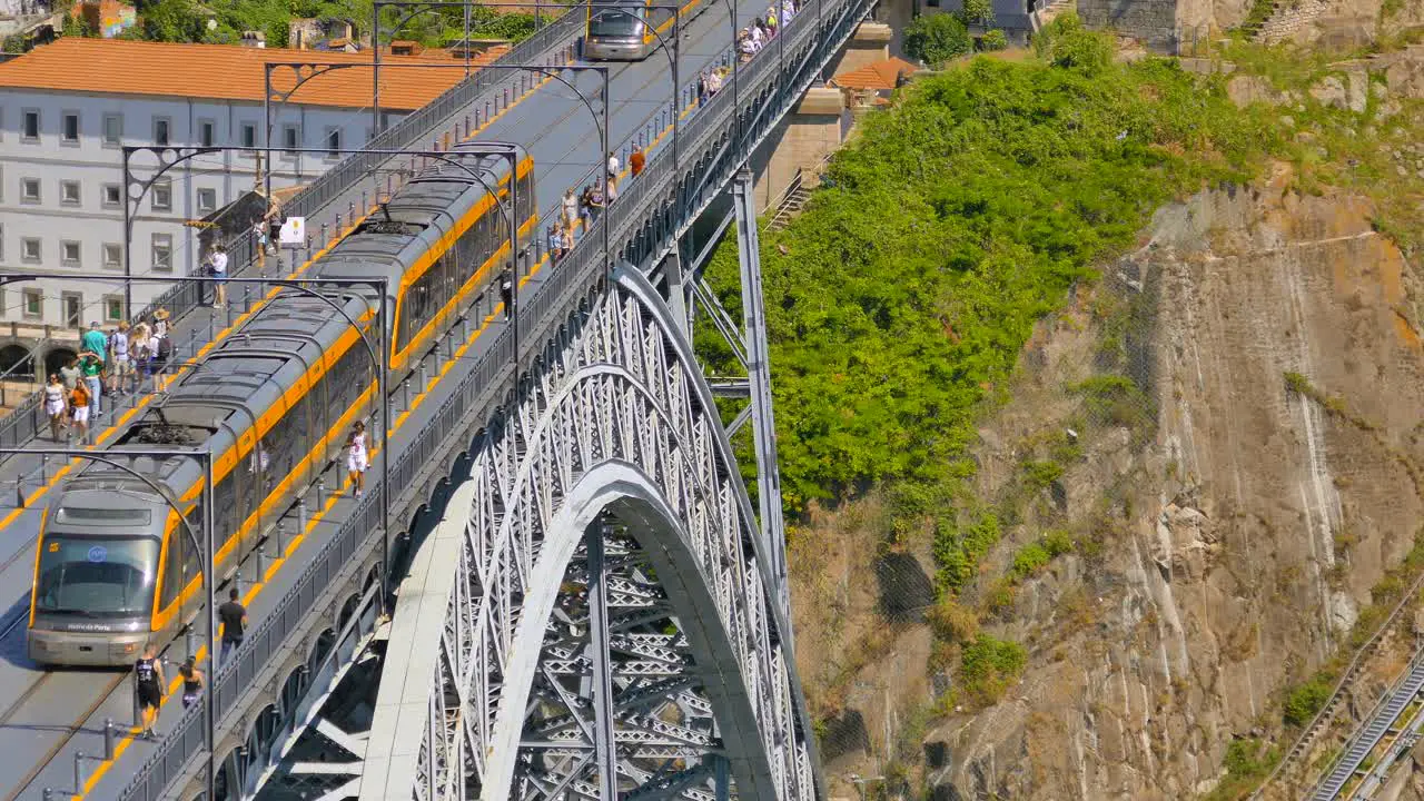 Closeup shot of the Dom Luis bridge in Porto showing the train going over the bridge