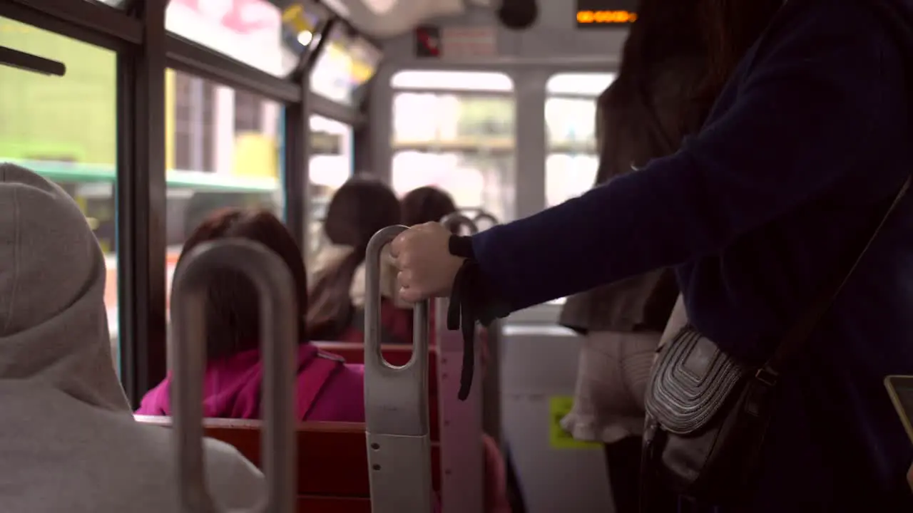 Holding Handrail on Tram