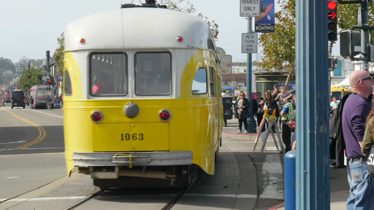 San Francisco Tram Passing Busy Sidewalk