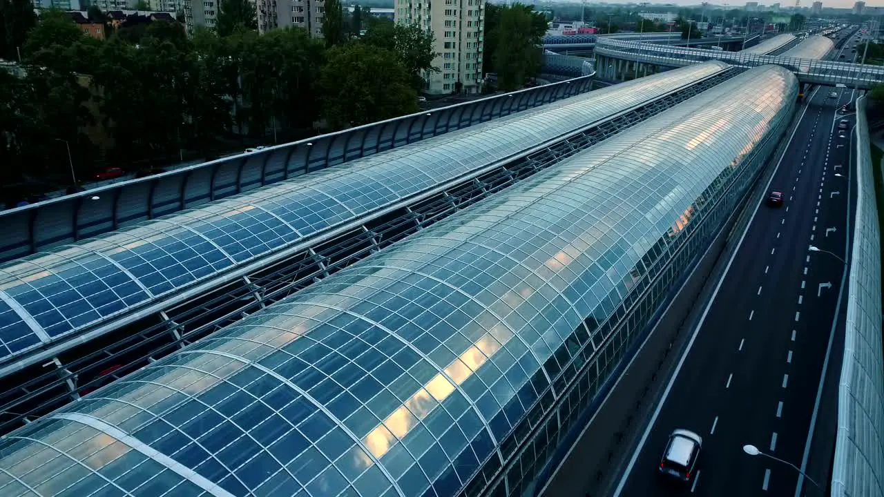 Drone view on a modern glass tunnel construction over the highway in Warsaw