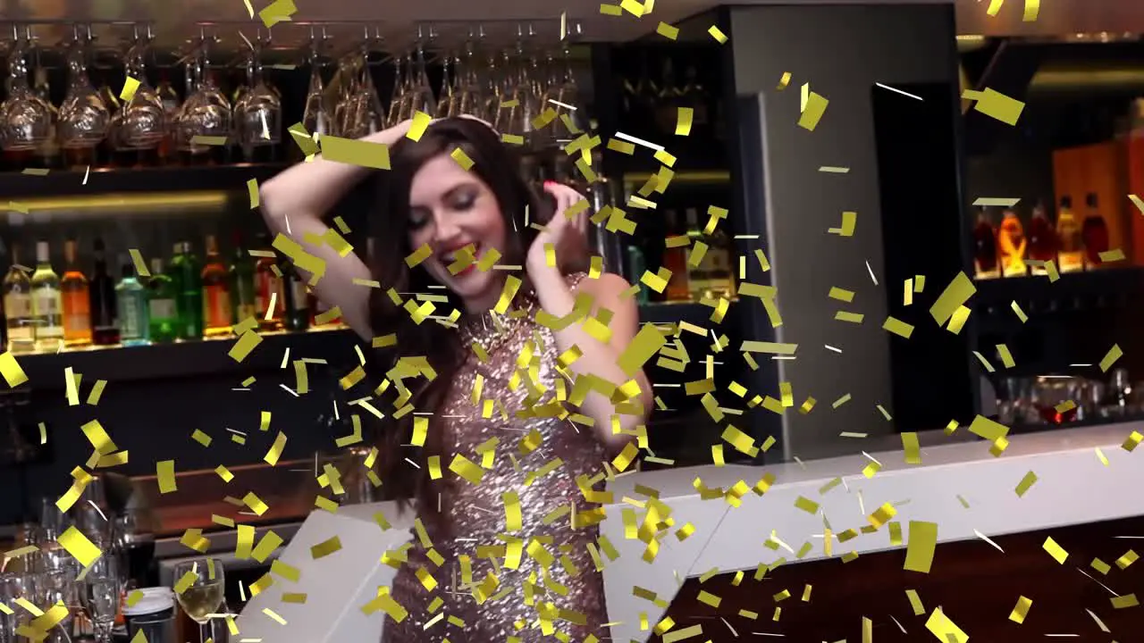 Animation of confetti falling over happy woman dancing at party