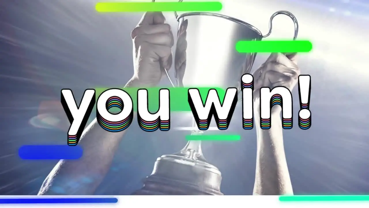 Animation of you win text in rainbow coloured letters and stripes over man holding silver cup