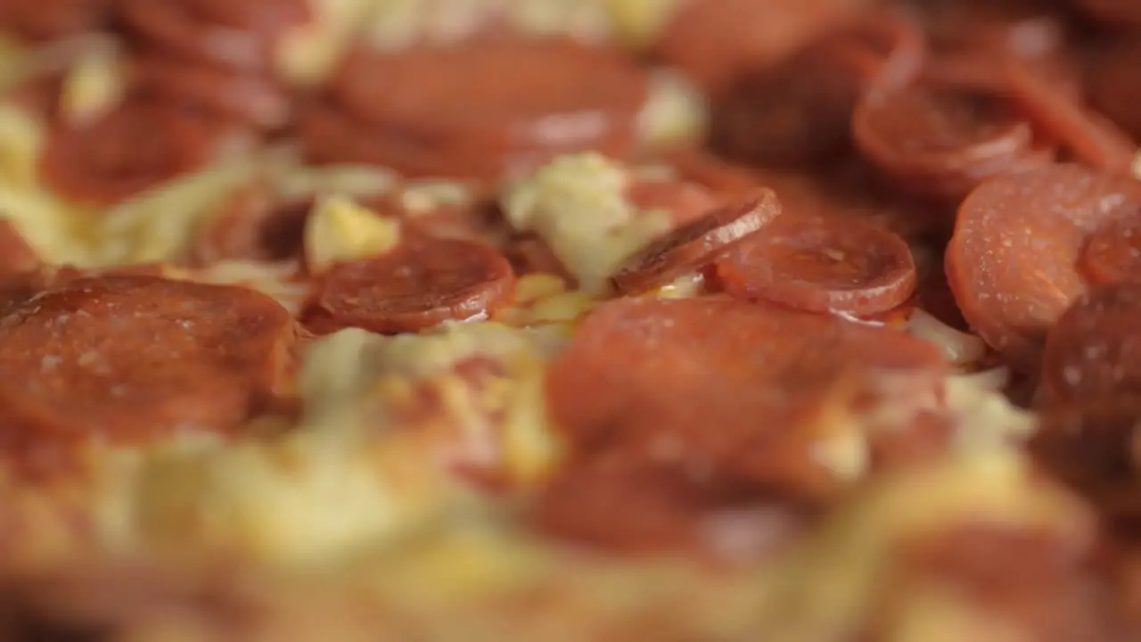 Pepperoni pizza with mozzarella cheese rotating close up shot