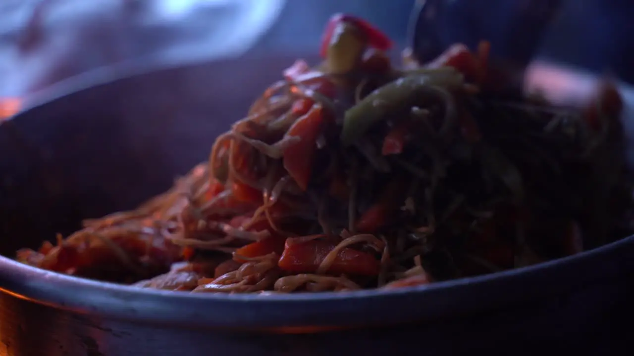 Mixing the noodles in the pan on top of the volcano in Guatemala