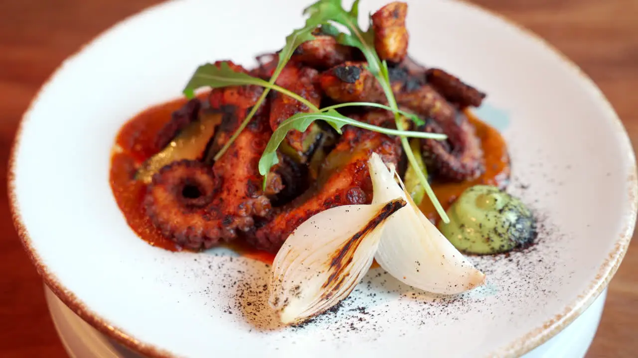 Octopus tentacle rotating plate gourmet mexican food