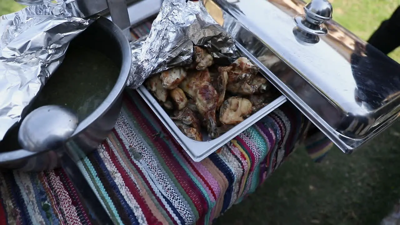 Barbecue and food on the table in the garden -push out top view