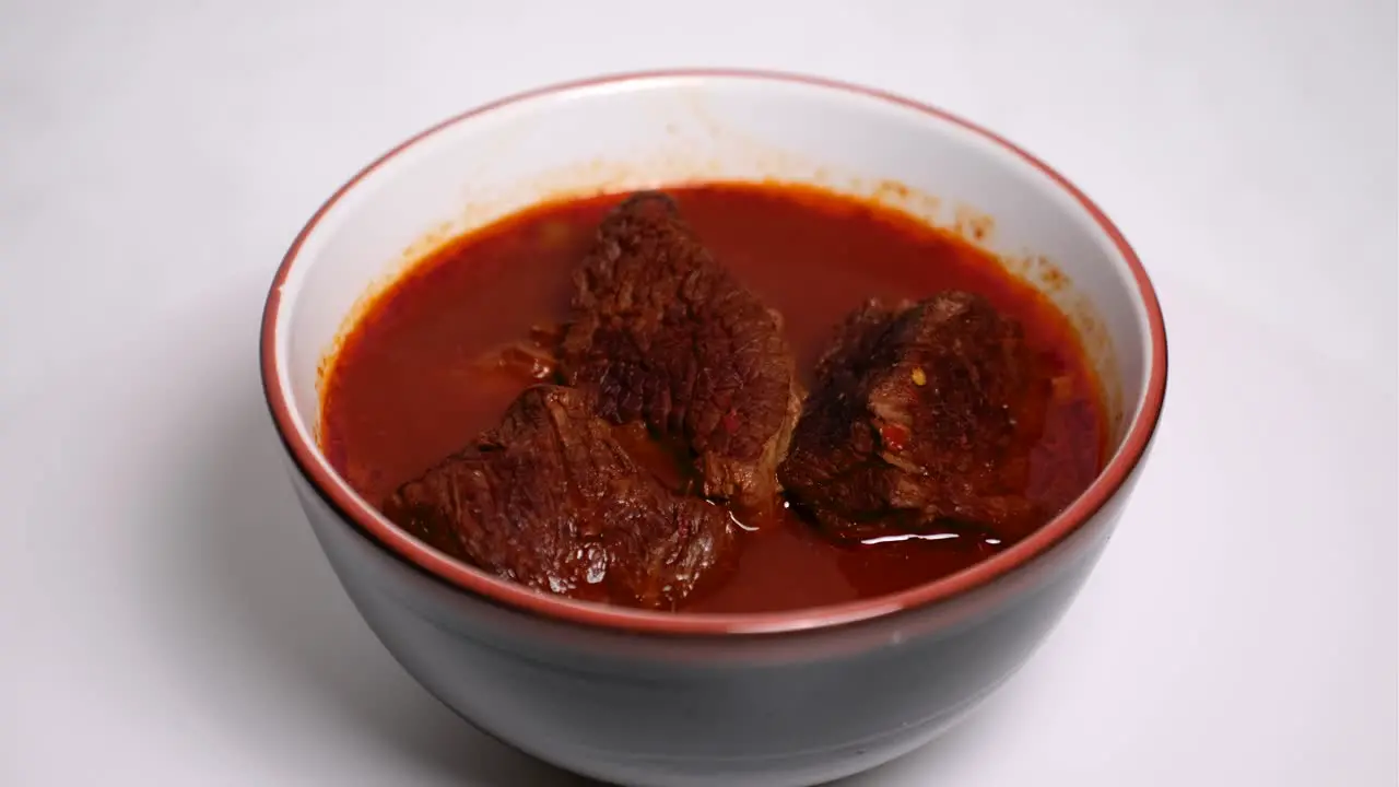 Birria bowl without garnish on a lazy susan