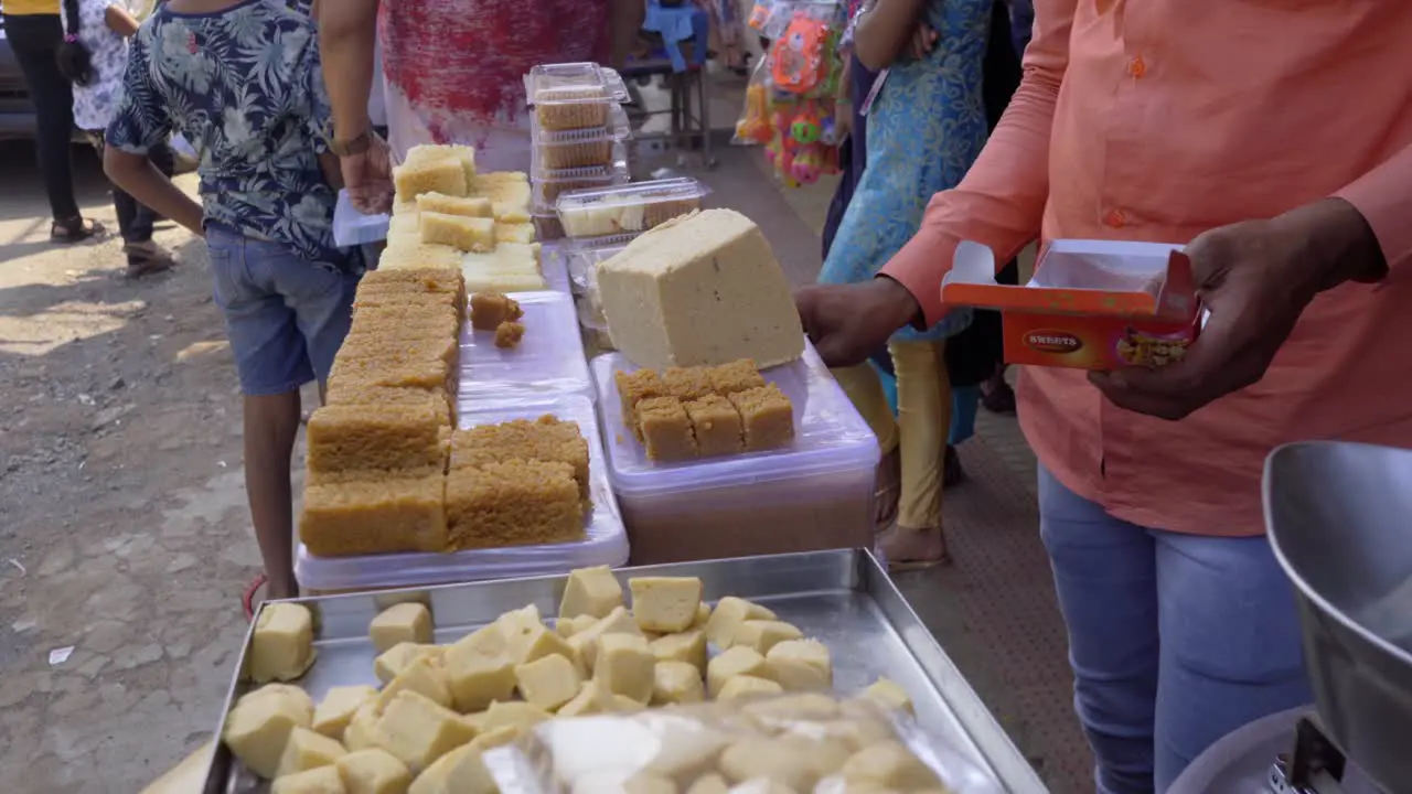 handicap man buying sweets from street vendors shops packing packaging