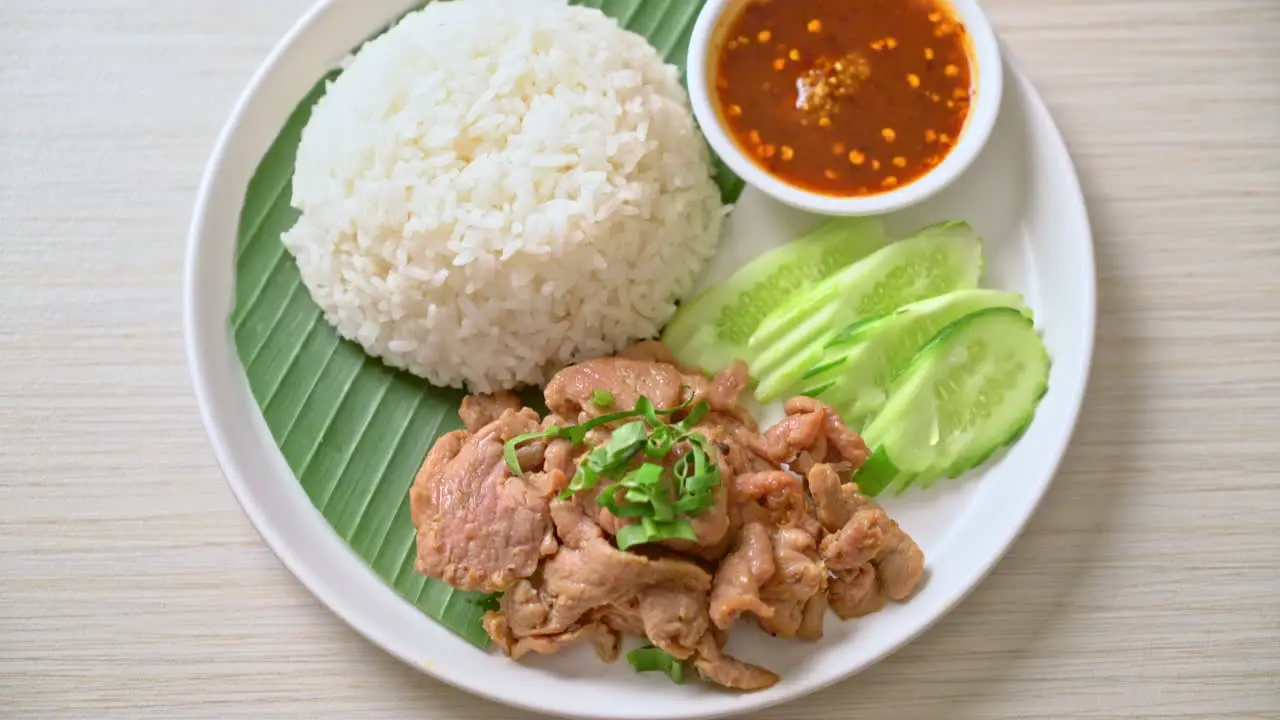 grilled pork garlic with rice with spicy sauce in Asian style