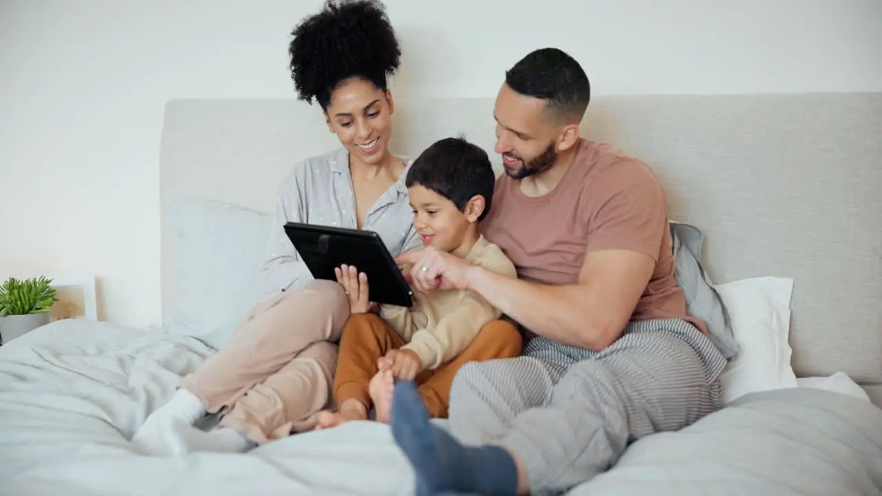 Happy family parents or son with tablet