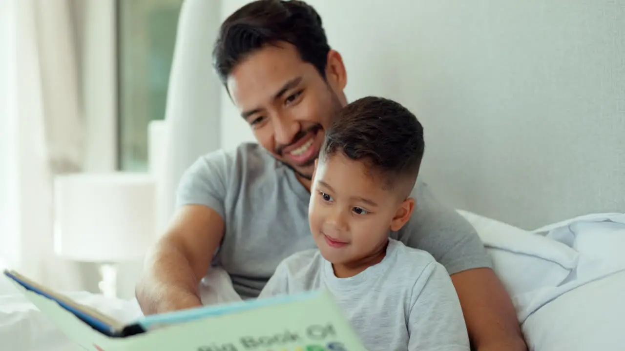 Dad boy and bedroom with book