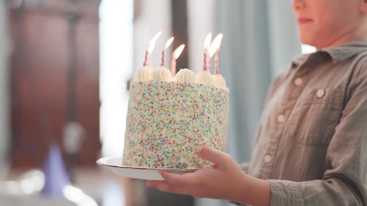 Boy carrying and birthday cake for celebration