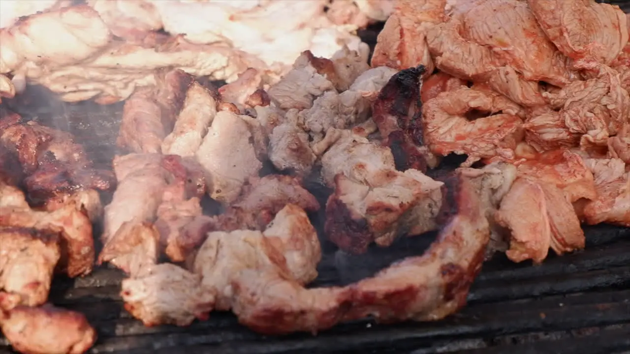 Cerdo pork cooking on hot grill at Leon street market in Nicaragua