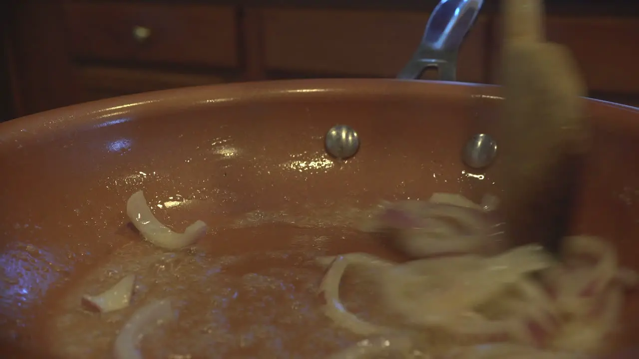 Cooking onions in a frying pan