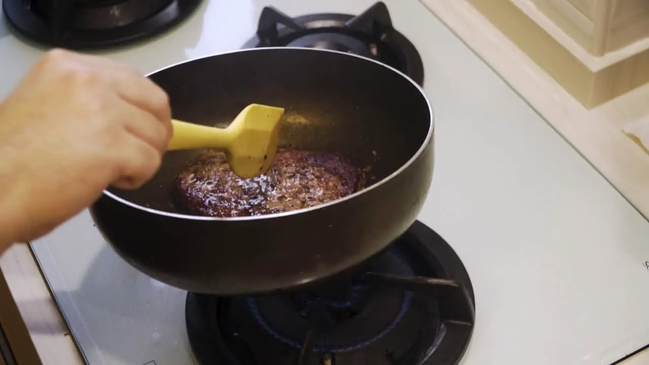 Hands Basting A4 Wagyu Steak With Butter In A Pan