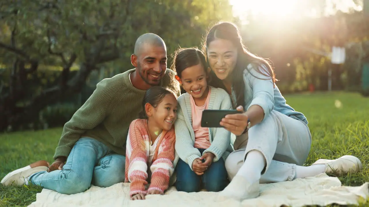 Happy family selfie and parents on a picnic